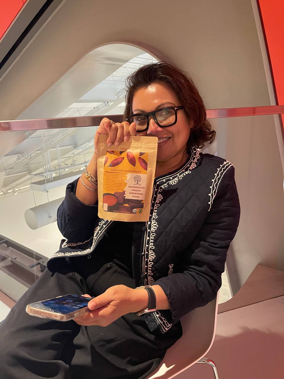 Nora Haron holding a bag of Agroverse ceremonial cacao